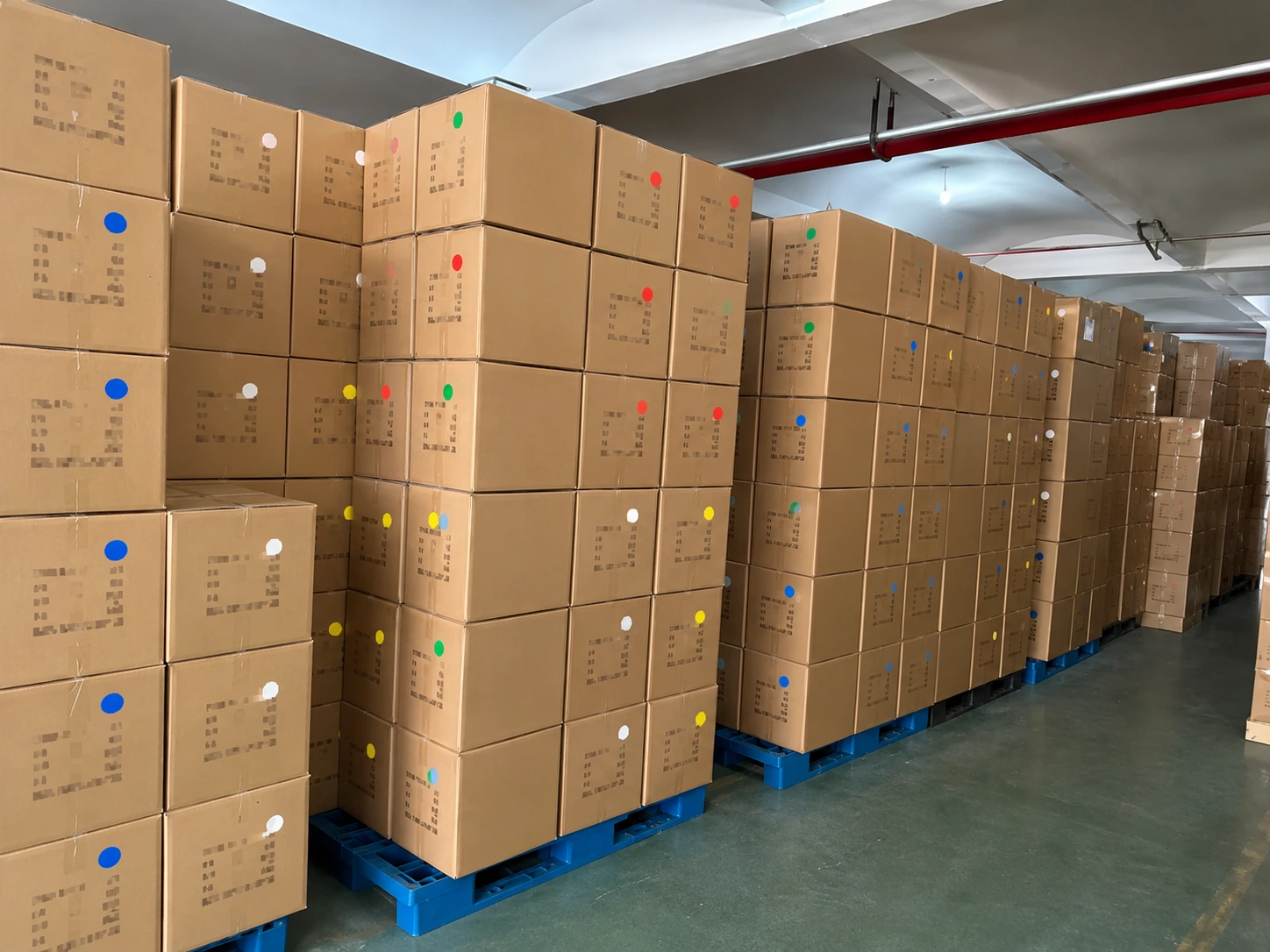 Packed cartons arranged in a warehouse area
